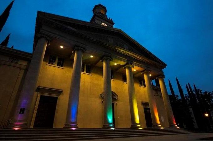 University of Redlands Chapel illuminated by rainbow colors in celebration of Pride Month and in honor of Will Wright '22.